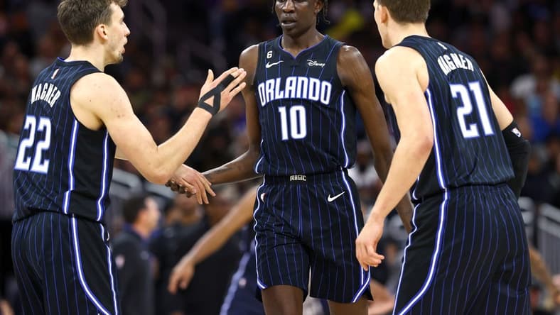 Dec 27, 2022; Orlando, Florida, USA; Orlando Magic forward Bol Bol (10) is congratulated by forward Franz Wagner (22) and center Moritz Wagner (21) against the Los Angeles Lakers during the second half at Amway Center. Mandatory Credit: Kim Klement-USA TODAY Sports