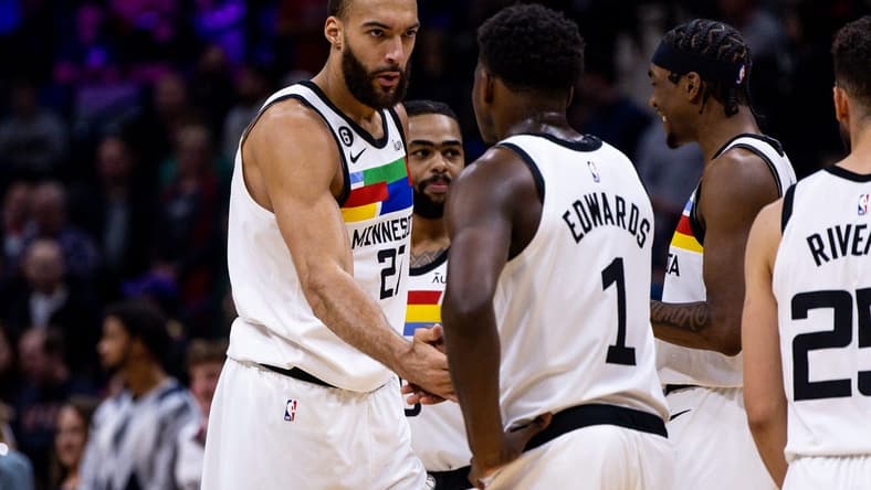 Dec 28, 2022; New Orleans, Louisiana, USA; Minnesota Timberwolves center Rudy Gobert (27) slaps hands with guard Anthony Edwards (1) against the New Orleans Pelicans during the first half at Smoothie King Center. Mandatory Credit: Stephen Lew-USA TODAY Sports