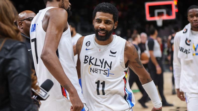 Dec 28, 2022; Atlanta, Georgia, USA; Brooklyn Nets forward Kevin Durant (7) and guard Kyrie Irving (11) celebrate after a victory against the Atlanta Hawks at State Farm Arena. Mandatory Credit: Brett Davis-USA TODAY Sports