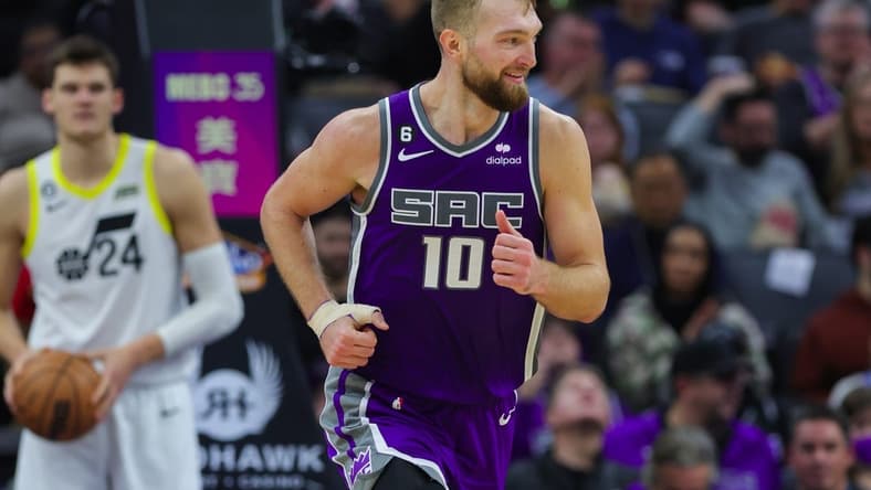 Dec 28, 2022; Sacramento, California, USA; Sacramento Kings forward Domantas Sabonis (10) runs up the court during the third quarter against the Utah Jazz at Golden 1 Center. Mandatory Credit: Sergio Estrada-USA TODAY Sports