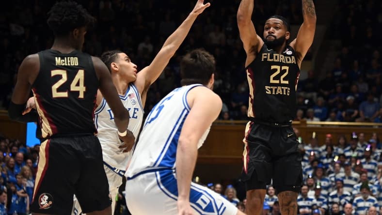 Dec 31, 2022; Durham, North Carolina, USA; Florida State Seminoles guard Darin Green Jr. (22) shoots as Duke Blue Devils guard Tyrese Proctor(5) defends during the first half at Cameron Indoor Stadium. Mandatory Credit: Rob Kinnan-USA TODAY Sports