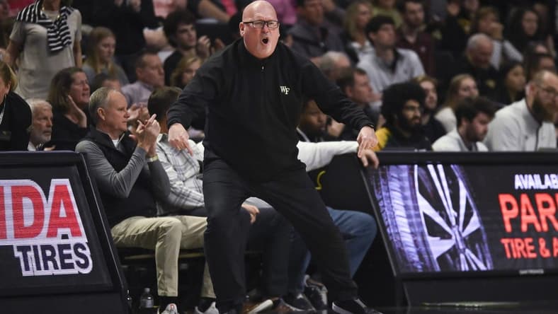 Dec 31, 2022; Winston-Salem, North Carolina, USA; Wake Forest Demon Deacons head coach Steve Forbes cheers on the team against the Virginia Tech Hokies during the second half at Lawrence Joel Veterans Memorial Coliseum. Mandatory Credit: William Howard-USA TODAY Sports
