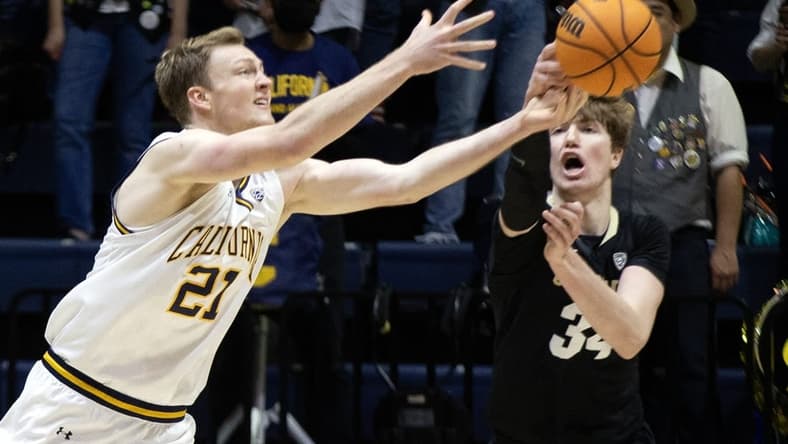 Dec 31, 2022; Berkeley, California, USA; California Golden Bears forward Lars Thiemann (21) and Colorado Buffaloes center Lawson Lovering (34) battle for a loose ball during the first half at Haas Pavilion. Mandatory Credit: D. Ross Cameron-USA TODAY Sports