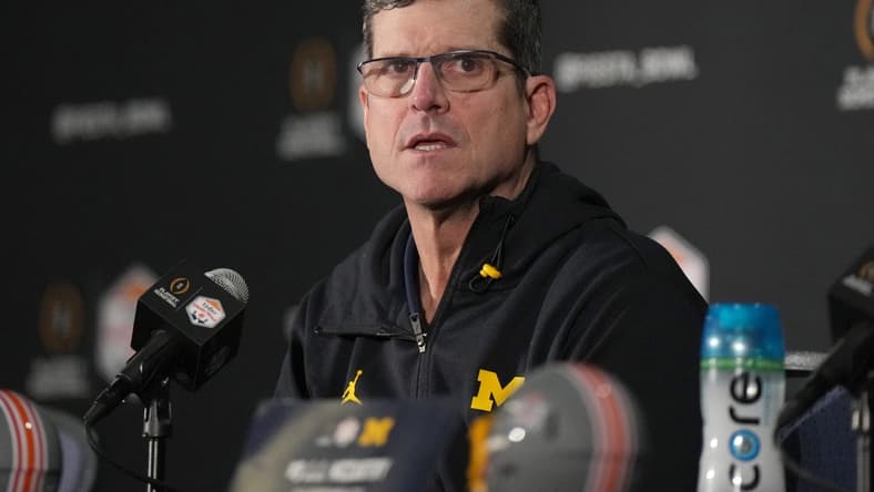Dec 31, 2022; Glendale, Arizona, USA; Michigan Wolverines head coach Jim Harbaugh speaks to the media after the 2022 Fiesta Bowl won by the TCU Horned Frogs, 51-45, at State Farm Stadium. Mandatory Credit: Kirby Lee-USA TODAY Sports