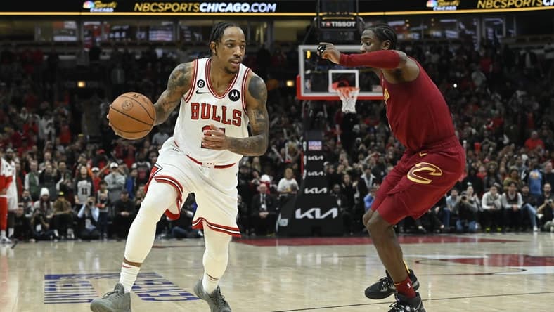 Dec 31, 2022; Chicago, Illinois, USA; Chicago Bulls forward DeMar DeRozan (11) dribbles the ball against Cleveland Cavaliers guard Caris LeVert (3) during the second half at United Center. Mandatory Credit: Matt Marton-USA TODAY Sports