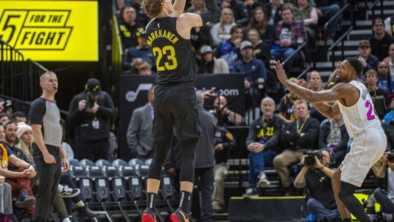 Dec 31, 2022; Salt Lake City, Utah, USA; Utah Jazz forward-center Lauri Markkanen (23) shoots the ball against Miami Heat forward Haywood Highsmith (24) during the first quarter at Vivint Arena. Mandatory Credit: Christopher Creveling-USA TODAY Sports