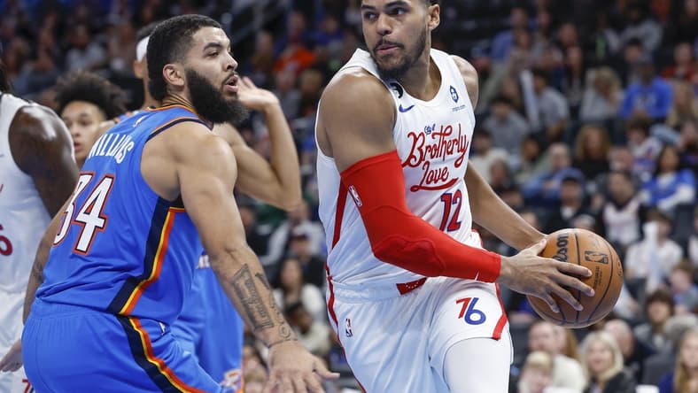 Dec 31, 2022; Oklahoma City, Oklahoma, USA; Philadelphia 76ers forward Tobias Harris (12) drives around Oklahoma City Thunder forward Kenrich Williams (34) during the second quarter at Paycom Center. Mandatory Credit: Alonzo Adams-USA TODAY Sports