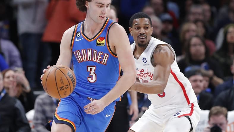 Dec 31, 2022; Oklahoma City, Oklahoma, USA; Oklahoma City Thunder guard Josh Giddey (3) controls the ball against Philadelphia 76ers guard De'Anthony Melton (8) during the first quarter at Paycom Center. Mandatory Credit: Alonzo Adams-USA TODAY Sports