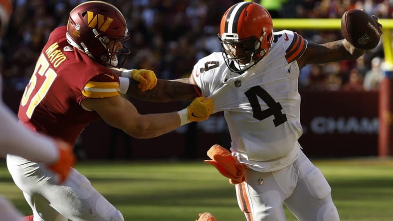 Jan 1, 2023; Landover, Maryland, USA; Cleveland Browns quarterback Deshaun Watson (4) scrambles from Washington Commanders linebacker David Mayo (51) during the first quarter at FedExField. Mandatory Credit: Geoff Burke-USA TODAY Sports