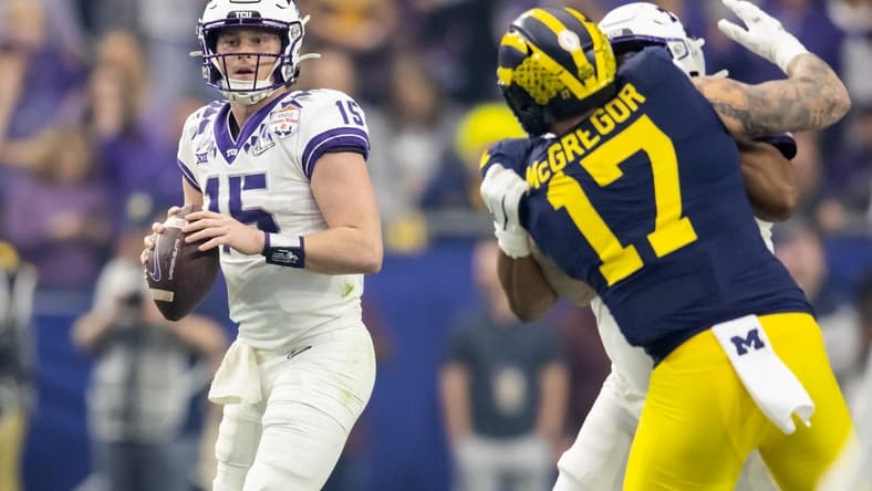 Dec 31, 2022; Glendale, Arizona, USA; TCU Horned Frogs quarterback Max Duggan (15) against the Michigan Wolverines during the 2022 Fiesta Bowl at State Farm Stadium. Mandatory Credit: Mark J. Rebilas-USA TODAY Sports