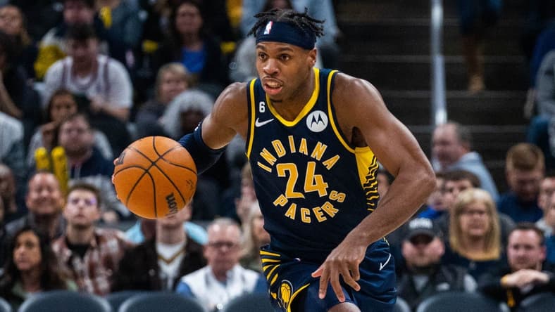 Jan 2, 2023; Indianapolis, Indiana, USA; Indiana Pacers guard Buddy Hield (24) dribbles the ball in the second quarter against the Toronto Raptors at Gainbridge Fieldhouse. Mandatory Credit: Trevor Ruszkowski-USA TODAY Sports