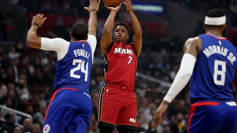 Jan 2, 2023; Los Angeles, California, USA;  Miami Heat guard Kyle Lowry (7) shoots the ball over Los Angeles Clippers forward Norman Powell (24) during the first quarter at Crypto.com Arena. Mandatory Credit: Kiyoshi Mio-USA TODAY Sports