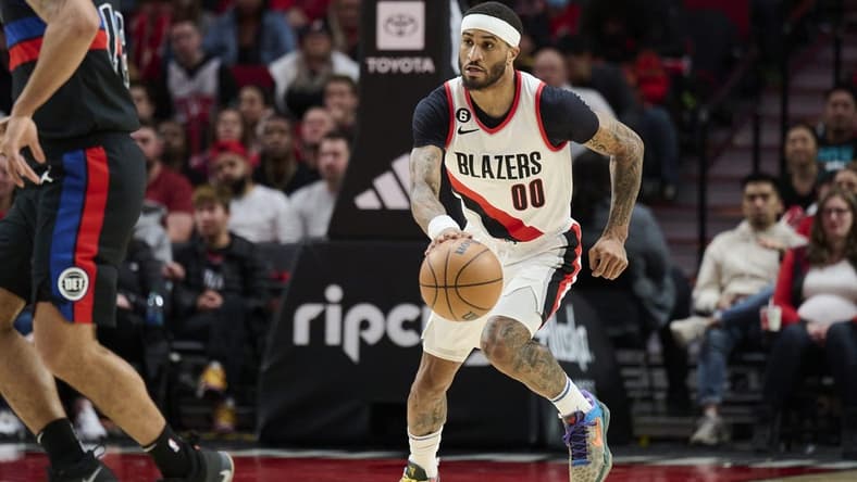 Jan 2, 2023; Portland, Oregon, USA; Portland Trail Blazers guard Gary Payton II (00) dribbles the ball during the second half against the Detroit Pistons at Moda Center. The Trail Blazers won 135-106. Mandatory Credit: Troy Wayrynen-USA TODAY Sports