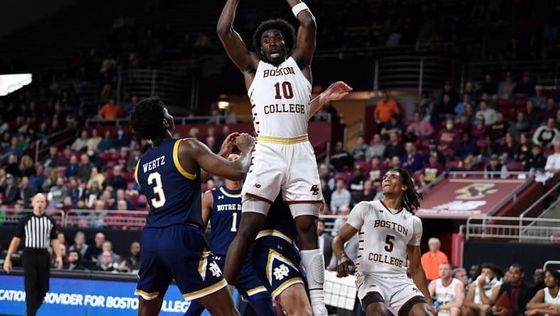 Jan 3, 2023; Chestnut Hill, Massachusetts, USA; Boston College Eagles guard Prince Aligbe (10) comes down with a rebound  during the second half against the Notre Dame Fighting Irish at Conte Forum. Mandatory Credit: Eric Canha-USA TODAY Sports