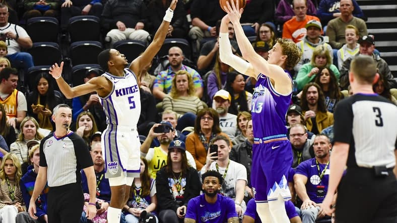 Jan 3, 2023; Salt Lake City, Utah, USA; Utah Jazz forward Lauri Markkanen (23) takes a shot over Sacramento Kings guard De'Aaron Fox (5) during the first quarter at Vivint Arena. Mandatory Credit: Christopher Creveling-USA TODAY Sports