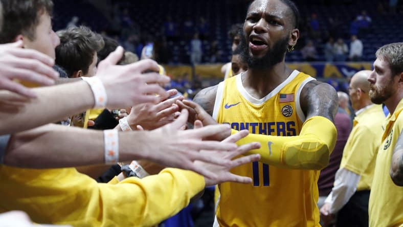 Jan 3, 2023; Pittsburgh, Pennsylvania, USA; Pittsburgh Panthers guard Jamarius Burton (11) celebrates with the PITT student section after defeating the Virginia Cavaliers at the Petersen Events Center. Mandatory Credit: Charles LeClaire-USA TODAY Sports