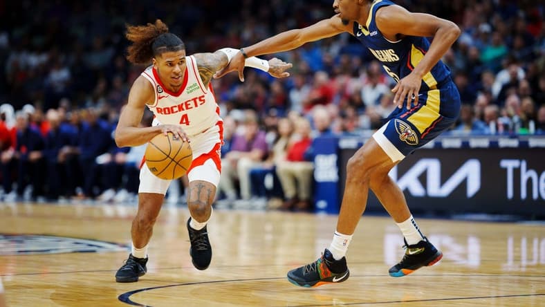 Jan 4, 2023; New Orleans, Louisiana, USA; Houston Rockets guard Jalen Green (4) drives to the basket against New Orleans Pelicans forward Herbert Jones (5) during the first quarter at Smoothie King Center. Mandatory Credit: Andrew Wevers-USA TODAY Sports