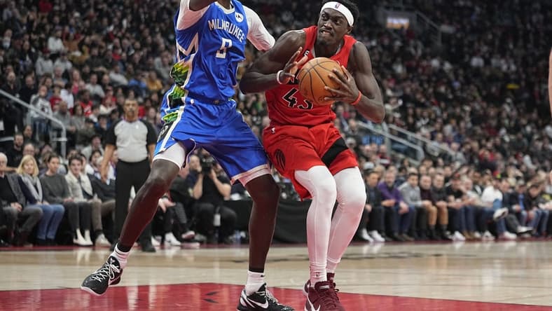 Jan 4, 2023; Toronto, Ontario, CAN; Toronto Raptors forward Pascal Siakam (43) drives to the net against Milwaukee Bucks forward Bobby Portis (9) during the first half at Scotiabank Arena. Mandatory Credit: John E. Sokolowski-USA TODAY Sports