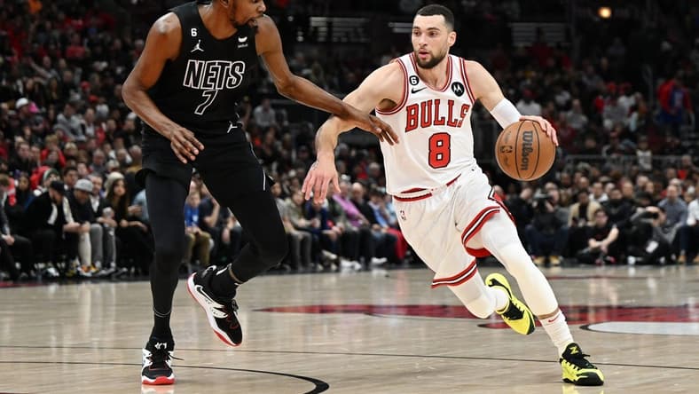 Jan 4, 2023; Chicago, Illinois, USA; Chicago Bulls guard Zach LaVine (8) drives in the first half against Brooklyn Nets forward Kevin Durant (7) at United Center. Mandatory Credit: Quinn Harris-USA TODAY Sports