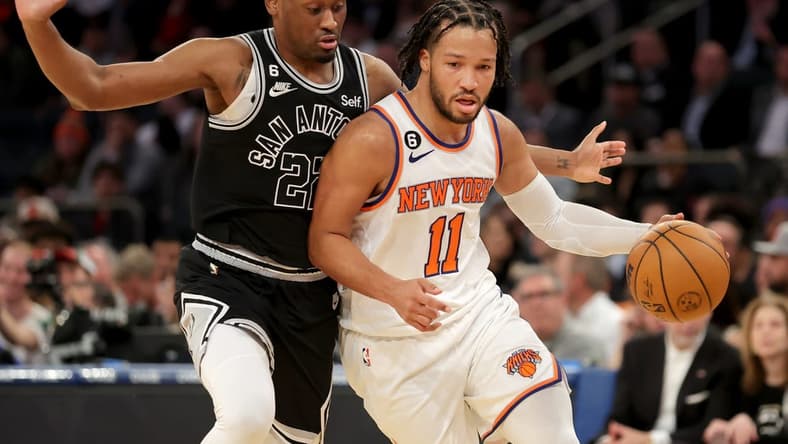 Jan 4, 2023; New York, New York, USA; New York Knicks guard Jalen Brunson (11) controls the ball against San Antonio Spurs guard Malaki Branham (22) during the fourth quarter at Madison Square Garden. Mandatory Credit: Brad Penner-USA TODAY Sports