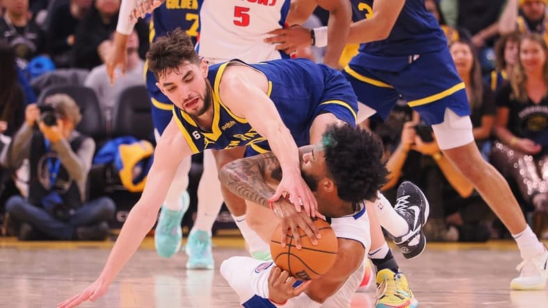 Jan 4, 2023; San Francisco, California, USA; Golden State Warriors shooting guard Ty Jerome (10) extends for the ball against Detroit Pistons small forward Saddiq Bey (41) on the floor during the second quarter at Chase Center. Mandatory Credit: Kelley L Cox-USA TODAY Sports