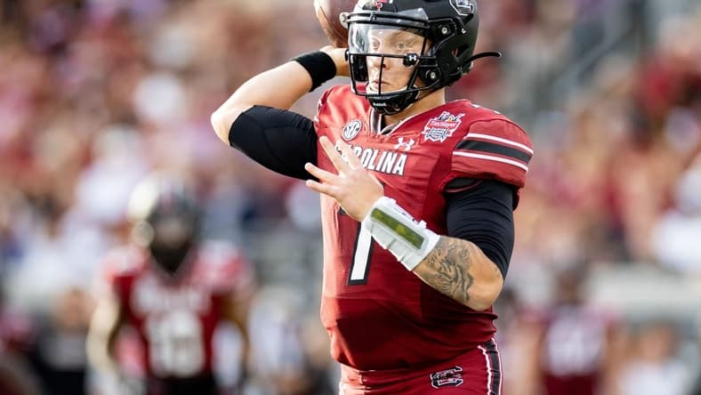 Dec 30, 2022; Jacksonville, FL, USA; South Carolina Gamecocks quarterback Spencer Rattler (7) throws the ball during the first half against the Notre Dame Fighting Irish in the 2022 Gator Bowl at TIAA Bank Field. Mandatory Credit: Matt Pendleton-USA TODAY Sports