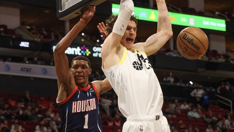 Jan 5, 2023; Houston, Texas, USA; Utah Jazz forward Lauri Markkanen (23) dunks against Houston Rockets forward Jabari Smith Jr. (1) at Toyota Center. Mandatory Credit: Thomas Shea-USA TODAY Sports