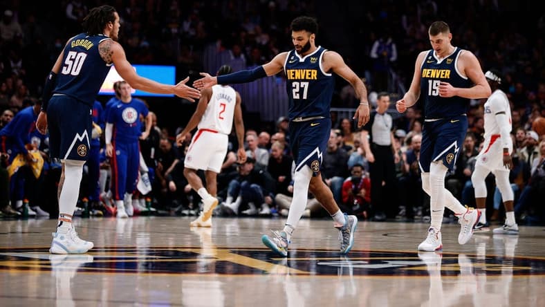 Jan 5, 2023; Denver, Colorado, USA; Denver Nuggets forward Aaron Gordon (50) reacts with guard Jamal Murray (27) and center Nikola Jokic (15) in the first quarter against the Los Angeles Clippers at Ball Arena. Mandatory Credit: Isaiah J. Downing-USA TODAY Sports