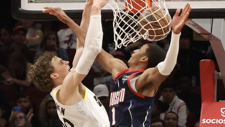 Jan 5, 2023; Houston, Texas, USA; Utah Jazz forward Lauri Markkanen (23) dunks against Houston Rockets forward Jabari Smith Jr. (1) in the second half at Toyota Center. Mandatory Credit: Thomas Shea-USA TODAY Sports