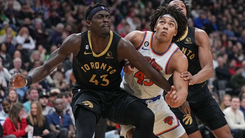 Jan 6, 2023; Toronto, Ontario, CAN; New York Knicks center Jericho Sims (45) battles for the rebound with Toronto Raptors forward Pascal Siakam (43) and Toronto Raptors forward Scottie Barnes (4) during the second quarter at Scotiabank Arena. Mandatory Credit: Nick Turchiaro-USA TODAY Sports