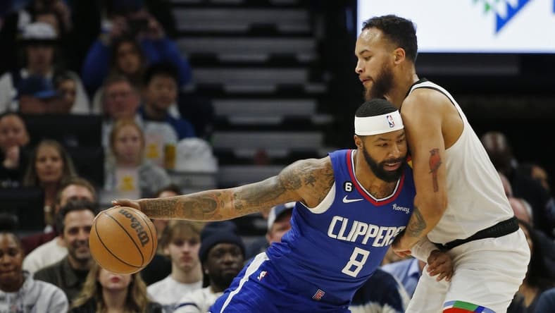 Jan 6, 2023; Minneapolis, Minnesota, USA; Los Angeles Clippers forward Marcus Morris (8) works against Minnesota Timberwolves center Rudy Gobert (27) in the first quarter at Target Center. Mandatory Credit: Bruce Kluckhohn-USA TODAY Sports