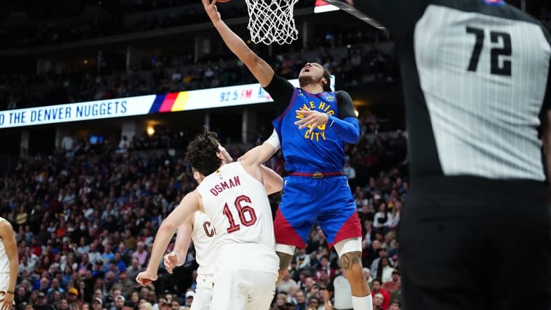 Jan 6, 2023; Denver, Colorado, USA; Denver Nuggets forward Aaron Gordon (50) shoots the ball over Cleveland Cavaliers forward Cedi Osman (16) in the second quarter at Ball Arena. Mandatory Credit: Ron Chenoy-USA TODAY Sports