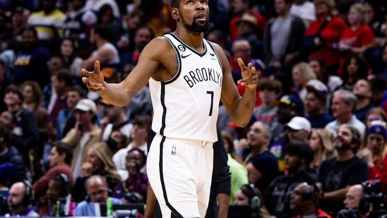 Jan 6, 2023; New Orleans, Louisiana, USA;  Brooklyn Nets forward Kevin Durant (7) reacts to guard Kyrie Irving (11) making a three point basket against the New Orleans Pelicans during the second half at Smoothie King Center. Mandatory Credit: Stephen Lew-USA TODAY Sports
