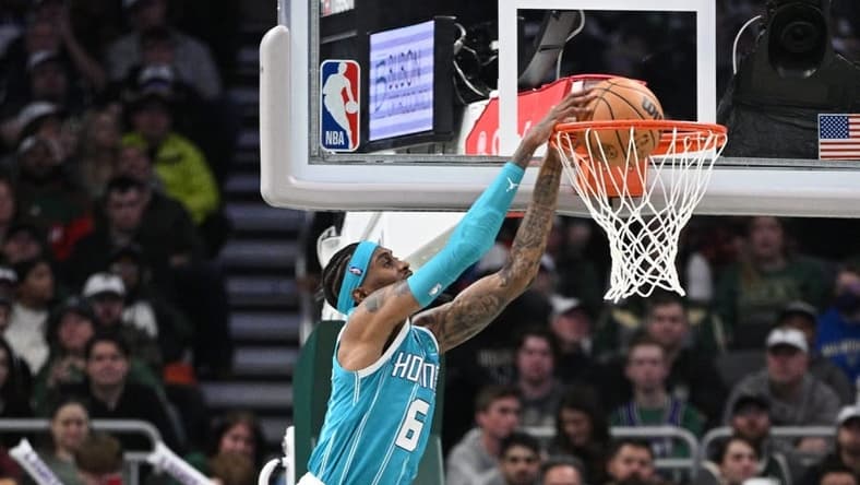 Jan 6, 2023; Milwaukee, Wisconsin, USA; Charlotte Hornets forward Jalen McDaniels (6) dunks the ball in the first half against the Milwaukee Bucks at Fiserv Forum. Mandatory Credit: Michael McLoone-USA TODAY Sports