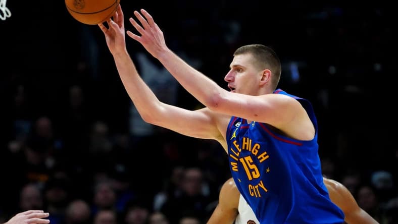Jan 6, 2023; Denver, Colorado, USA; Denver Nuggets center Nikola Jokic (15) passes the ball in the second half against the Cleveland Cavaliers at Ball Arena. Mandatory Credit: Ron Chenoy-USA TODAY Sports