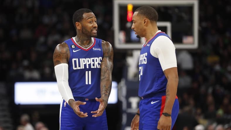 Jan 6, 2023; Minneapolis, Minnesota, USA; Los Angeles Clippers guard John Wall (11) and guard Norman Powell (24) discuss strategy as they play the Minnesota Timberwolves in the fourth quarter at Target Center. Mandatory Credit: Bruce Kluckhohn-USA TODAY Sports