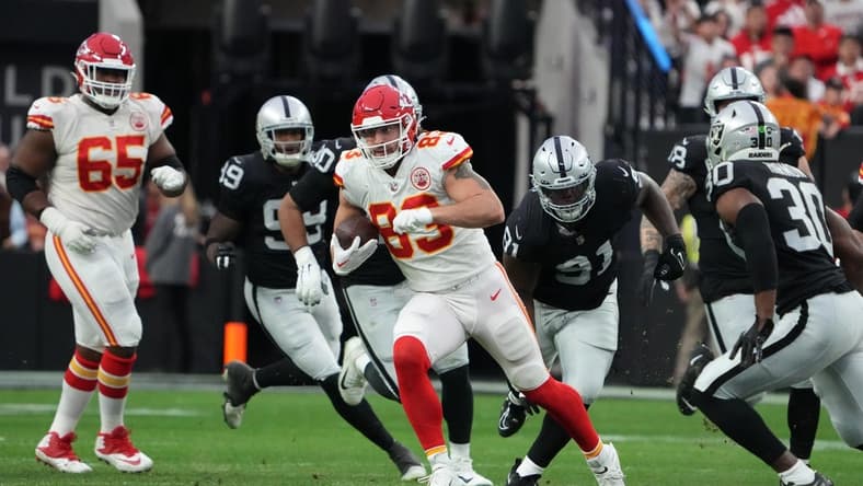 Jan 7, 2023; Paradise, Nevada, USA; Kansas City Chiefs tight end Noah Gray (83) carries the ball against the Las Vegas Raiders in the first half at Allegiant Stadium. Mandatory Credit: Kirby Lee-USA TODAY Sports