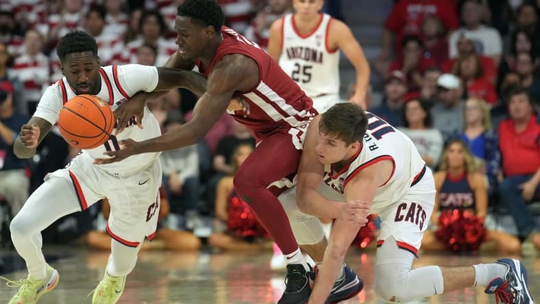Jan 7, 2023; Tucson, Arizona, USA; Arizona Wildcats guard Courtney Ramey (0) and Arizona Wildcats center Oumar Ballo (11) defend against Washington State Cougars guard TJ Bamba (5) during the second half at McKale Center. Mandatory Credit: Joe Camporeale-USA TODAY Sports