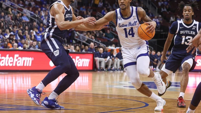 Jan 7, 2023; Newark, New Jersey, USA; Seton Hall Pirates guard Dre Davis (14) drives to the basket against Butler Bulldogs guard Pierce Thomas (14) during the second half at Prudential Center. Mandatory Credit: Vincent Carchietta-USA TODAY Sports