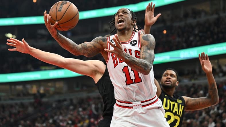 Jan 7, 2023; Chicago, Illinois, USA; Chicago Bulls guard DeMar DeRozan (11) attempts a shot under the basket against the Utah Jazz in the second half at United Center. Chicago defeated Utah 126-118. Mandatory Credit: Jamie Sabau-USA TODAY Sports