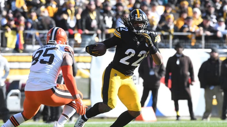 Jan 8, 2023; Pittsburgh, Pennsylvania, USA; Pittsburgh Steelers runninmg back Najee Harris (22) runs from Cleveland Browns defensive end Myles Garrett (95) during the first quarter at Acrisure Stadium. Mandatory Credit: Philip G. Pavely-USA TODAY Sports