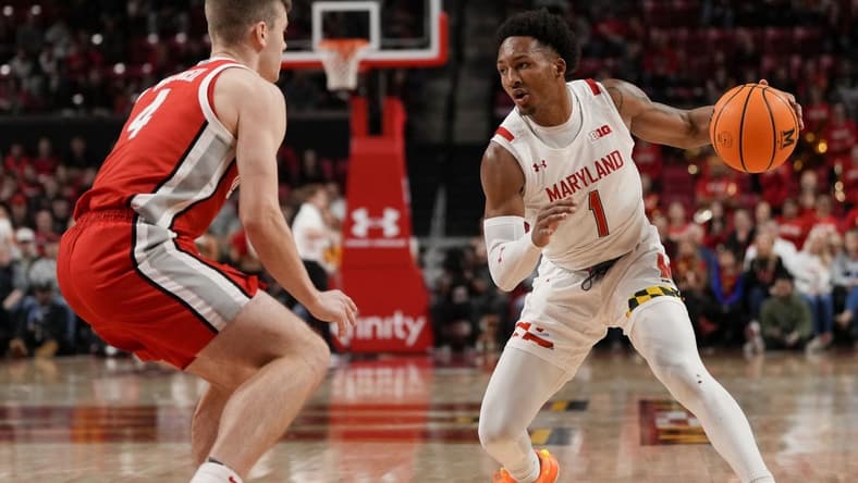 Jan 8, 2023; College Park, Maryland, USA; Maryland Terrapins guard Jahmir Young (1) dribbles the ball while being guarded by Ohio State Buckeyes guard Sean McNeil (4) in the second half at Xfinity Center. Mandatory Credit: Brent Skeen-USA TODAY Sports