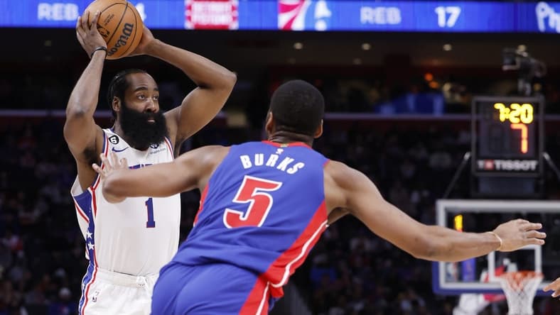 Jan 8, 2023; Detroit, Michigan, USA;  Philadelphia 76ers guard James Harden (1) is defended by Detroit Pistons guard Alec Burks (5) in the first half at Little Caesars Arena. Mandatory Credit: Rick Osentoski-USA TODAY Sports