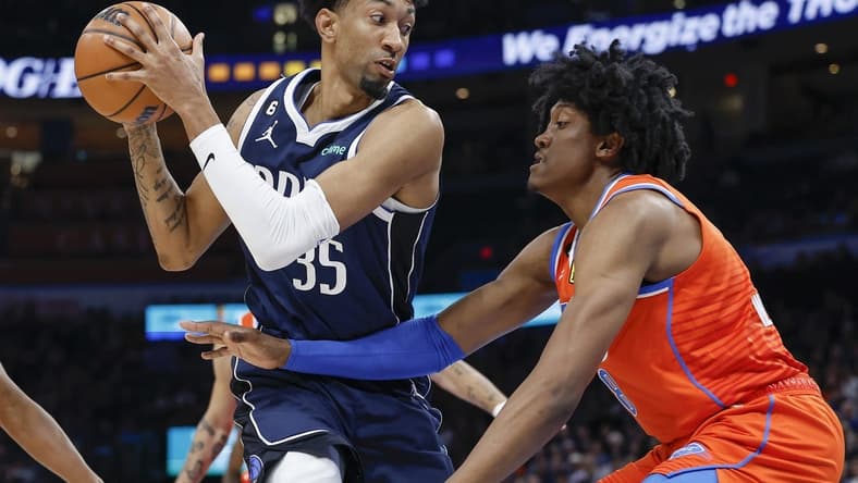 Jan 8, 2023; Oklahoma City, Oklahoma, USA; Dallas Mavericks forward Christian Wood (35) is defended by Oklahoma City Thunder forward Jalen Williams (8) on a drive during the first quarter at Paycom Center. Mandatory Credit: Alonzo Adams-USA TODAY Sports