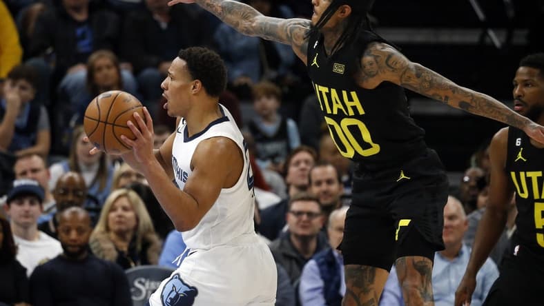 Jan 8, 2023; Memphis, Tennessee, USA; Memphis Grizzlies guard Desmond Bane (22) passes the ball as Utah Jazz guard Jordan Clarkson (00) defends during the second half at FedExForum. Mandatory Credit: Petre Thomas-USA TODAY Sports
