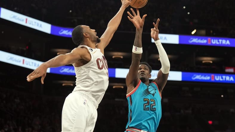 Jan 8, 2023; Phoenix, Arizona, USA; Phoenix Suns center Deandre Ayton (22) shoots over Cleveland Cavaliers forward Evan Mobley (4) during the first half at Footprint Center. Mandatory Credit: Joe Camporeale-USA TODAY Sports