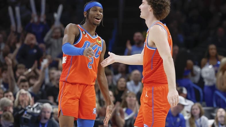 Jan 8, 2023; Oklahoma City, Oklahoma, USA; Oklahoma City Thunder guard Shai Gilgeous-Alexander (2) and Oklahoma City Thunder guard Josh Giddey (3) celebrate after scoring against the Dallas Mavericks during the second half at Paycom Center. Mandatory Credit: Alonzo Adams-USA TODAY Sports