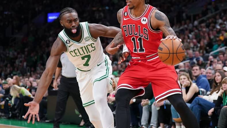 Jan 9, 2023; Boston, Massachusetts, USA; Chicago Bulls forward DeMar DeRozan (11) drives the ball against Boston Celtics guard Jaylen Brown (7) in the first quarter at TD Garden. Mandatory Credit: David Butler II-USA TODAY Sports