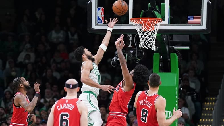 Jan 9, 2023; Boston, Massachusetts, USA; Boston Celtics forward Jayson Tatum (0) shoots against Chicago Bulls guard Coby White (0) in the first quarter at TD Garden. Mandatory Credit: David Butler II-USA TODAY Sports