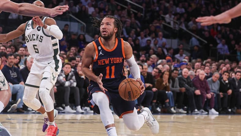 Jan 9, 2023; New York, New York, USA; New York Knicks guard Jalen Brunson (11) drives to the basket in front of Milwaukee Bucks guard Jevon Carter (5) during the first half at Madison Square Garden. Mandatory Credit: Vincent Carchietta-USA TODAY Sports